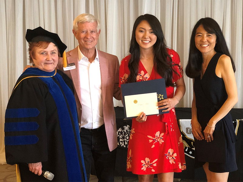 Dr. Joyce Campbell, Richard Sherman and 2019 scholarship recipient and parent